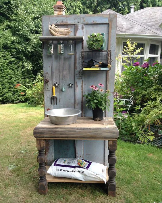 Altered Olives, a British Columbia-based company that creates custom recycled furniture, crafted this one-of-a-kind potting bench from an old wooden door and other salvaged items. - CountryLiving.com: 
