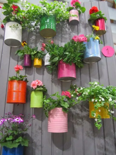 Recycled cans and little bit paint, so colorful and cute! Great idea for a little herb garden! | Outdoor Areas: 