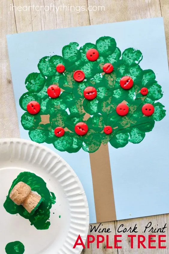 This wine cork stamped apple tree craft makes a fabulous fall kids craft, preschool craft and apple craft for kids.