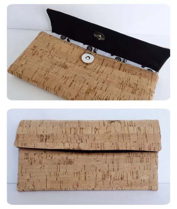 Wallet with 4 compartments for cards which fit several, 2 compartments for notes and documents, 1 compartment with zipper for coins and magnetic closure. The materials used for making the wallet were cork sheet and cotton fabrics in black and white tones.