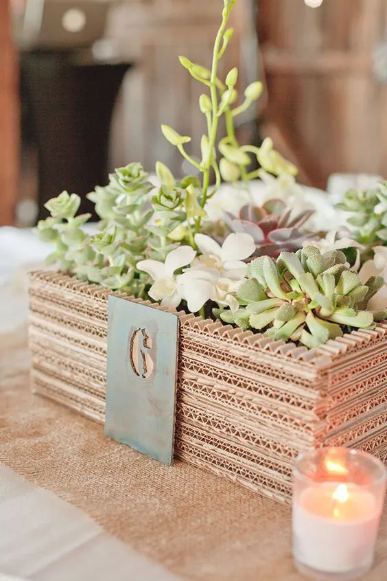 amazing little planter centerpiece made from layers of cardboard: 