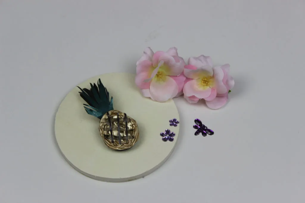 broche con capsulas de cafe