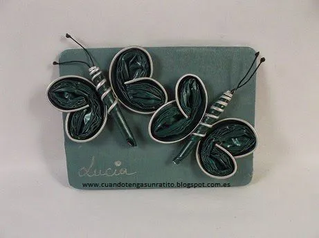 broche mariposa de capsulas