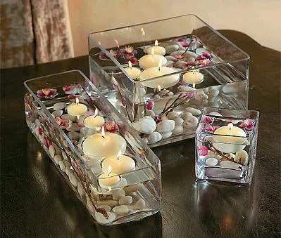 Centro de mesa con velas flotantes de guiaparadecorar.com